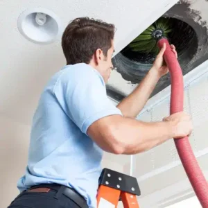 Air duct vent being cleaned